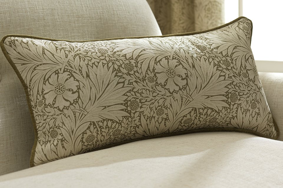 Morris and co rectangle cushions in light green floral pattern on cream accent chair.